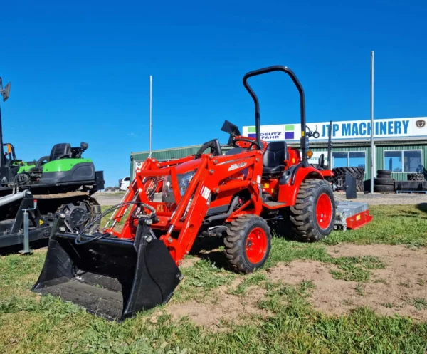 Orange Kioti Tractor on Grass